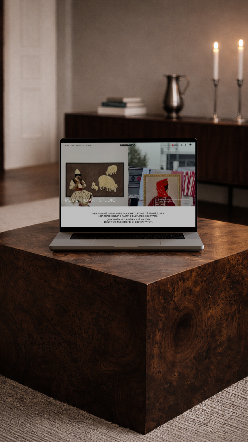 Memento Art Studio website shown on a MacBook, by Dweb Studio